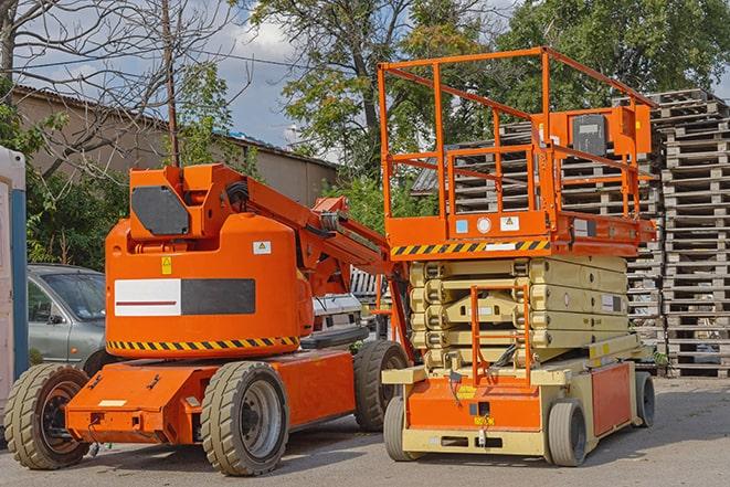 warehouse worker operating a heavy-duty forklift in Blue Jay